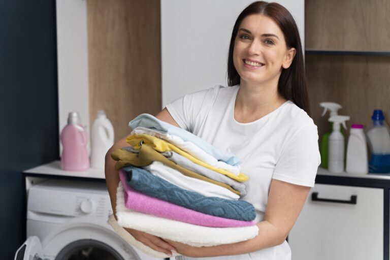 woman-holding-pile-clean-clothes